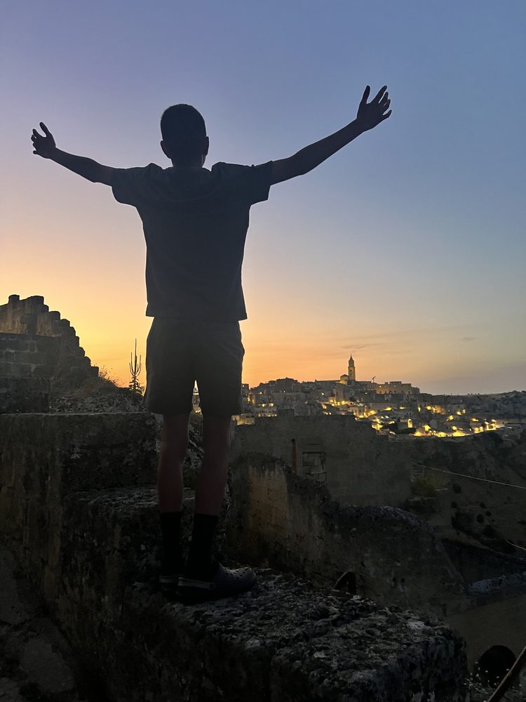 Matera's old city lit up at dusk